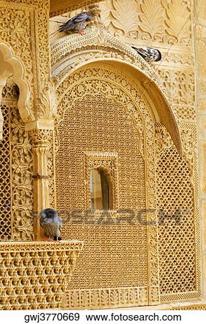 Pigeons sitting on the ledge of a window, Jaisalmer, Rajasthan, India View Large Photo Image Stock Photo - Pigeons sitting on the ledge of a window, Jaisalmer, Rajasthan, India. Fotosearch