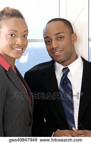Portrait of a businessman and a businesswoman View Large Photo Image Stock Photo - Portrait of a businessman and a businesswoman. Fotosearch