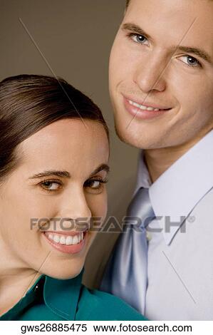Portrait of a businessman and a businesswoman smiling View Large Photo Image Stock Photography - Portrait of a businessman and a businesswoman smiling. Fotosearch