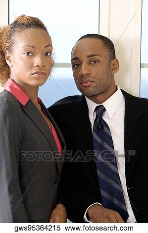 Portrait of a businessman and a businesswoman View Large Photo Image Stock Photography - Portrait of a businessman and a businesswoman. Fotosearch
