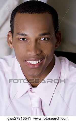 Portrait of a businessman smiling View Large Photo Image Stock Image - Portrait of a businessman smiling. Fotosearch