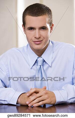 Portrait of a businessman smiling View Large Photo Image Stock Image - Portrait of a businessman smiling. Fotosearch