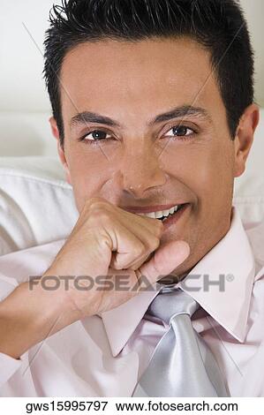 Stock Photo - Portrait of a businessman smiling. Fotosearch