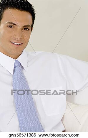 Portrait of a businessman smiling View Large Photo Image Stock Photograph - Portrait of a businessman smiling. Fotosearch