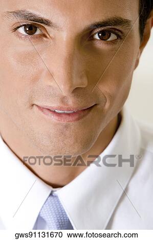 Portrait of a businessman smirking View Large Photo Image Stock Image - Portrait of a businessman smirking. Fotosearch