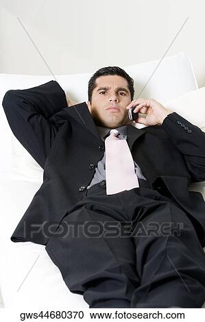 Stock Image - Portrait of a businessman talking on a mobile phone. Fotosearch