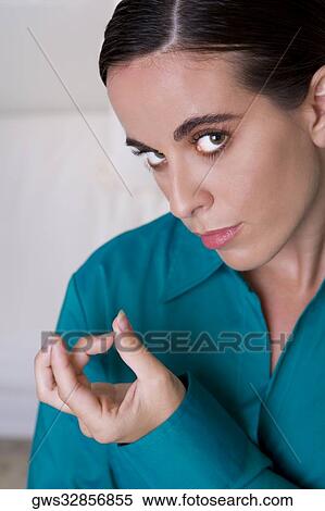 Portrait of a businesswoman gesturing with her hand View Large Photo Image Stock Photography - Portrait of a businesswoman gesturing with her hand. Fotosearch