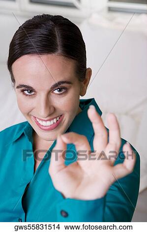 Portrait of a businesswoman making an ok sign View Large Photo Image Picture - Portrait of a businesswoman making an ok sign. Fotosearch
