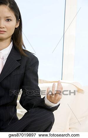 Portrait of a businesswoman sitting in the lotus position View Large Photo Image Stock Photo - Portrait of a businesswoman sitting in the lotus position. Fotosearch