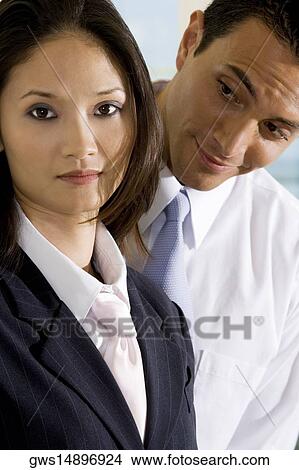 Picture - Portrait of a businesswoman standing with a businessman. Fotosearch