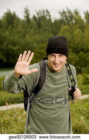 Portrait of a mid adult man carrying a backpack View Large Photo Image Stock Image - Portrait of a mid adult man carrying a backpack. Fotosearch