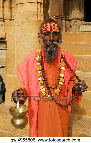 Portrait of a sadhu holding a vase, Jaisalmer, Rajasthan, India View Large Photo Image Stock Photograph - Portrait of a sadhu holding a vase, Jaisalmer, Rajasthan, India. Fotosearch
