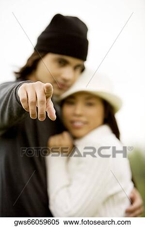 Portrait of a young couple embracing each other View Large Photo Image Stock Photography - Portrait of a young couple embracing each other. Fotosearch