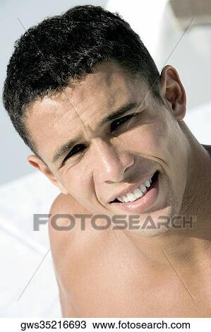Portrait of a young man smiling View Large Photo Image Stock Image - Portrait of a young man smiling. Fotosearch