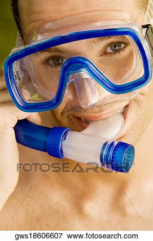 Portrait of a young man wearing a snorkel View Large Photo Image Stock Photo - Portrait of a young man wearing a snorkel. Fotosearch