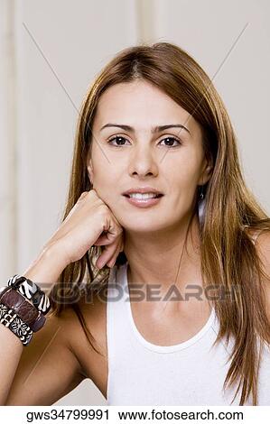 Stock Image - Portrait of a young woman smiling. Fotosearch