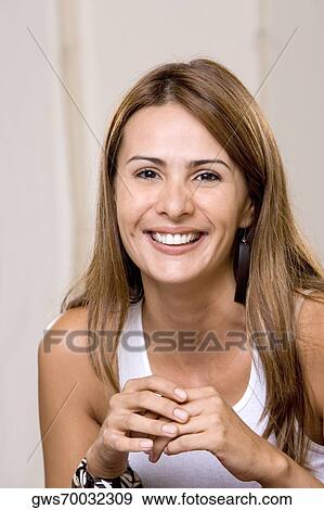 Stock Photo - Portrait of a young woman smiling. Fotosearch