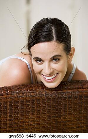 Portrait of a young woman smiling View Large Photo Image Stock Photograph - Portrait of a young woman smiling. Fotosearch