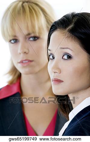 Portrait of two businesswomen looking serious View Large Photo Image Stock Photo - Portrait of two businesswomen looking serious. Fotosearch