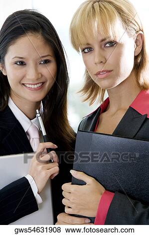Portrait of two businesswomen smiling View Large Photo Image Stock Photo - Portrait of two businesswomen smiling. Fotosearch