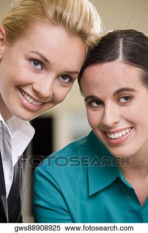 Portrait of two young women smiling View Large Photo Image Stock Photography - Portrait of two young women smiling. Fotosearch