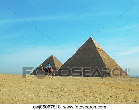 Pyramids on a landscape, Giza Pyramids, Giza, Cairo, Egypt View Large Photo Image Stock Photo - Pyramids on a landscape, Giza Pyramids, Giza, Cairo, Egypt. Fotosearch