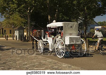 Rear view of a carriage on the street View Large Photo Image Stock Photo - Rear view of a carriage on the street. Fotosearch