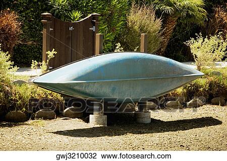 Stock Image - Rear view of a rowboat on a shore. Fotosearch