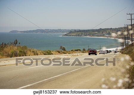 Rear view of cars on a highway, Malibu, California, USA View Large Photo Image Stock Photo - Rear view of cars on a highway, Malibu, California, USA. Fotosearch