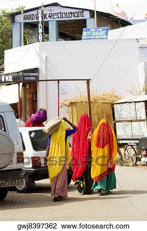 Rear view of three women walking on the streets, Pushkar, Rajasthan, India View Large Photo Image Stock Image - Rear view of three women walking on the streets, Pushkar, Rajasthan, India. Fotosearch