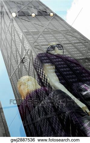 Stock Photograph - Reflection of a building, John Hancock Building, Chicago, Illinois, USA. Fotosearch