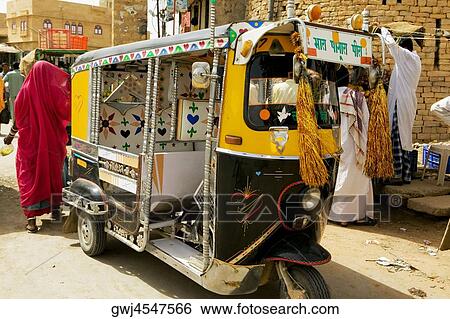 Rickshaw parked on the street, Jaisalmer, Rajasthan, India View Large Photo Image Stock Photograph - Rickshaw parked on the street, Jaisalmer, Rajasthan, India. Fotosearch