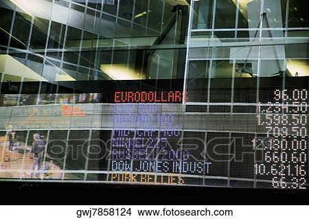 Screen showing currency and market rates through a window of a building View Large Photo Image Picture - Screen showing currency and market rates through a window of a building. Fotosearch