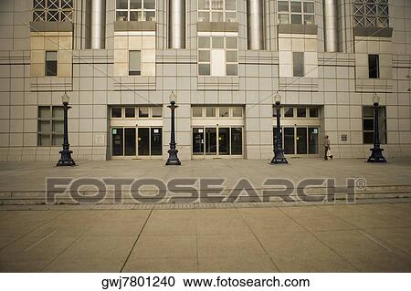 Stock Image - Side profile of a man walking in front of a building, San Francisco, California, USA. Fotosearch