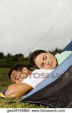 Side profile of a young woman and a mid adult man resting View Large Photo Image Stock Image - Side profile of a young woman and a mid adult man resting. Fotosearch