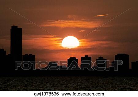 Silhouette of buildings at sunset, Chicago, Illinois, USA View Large Photo Image Stock Photograph - Silhouette of buildings at sunset, Chicago, Illinois, USA. Fotosearch