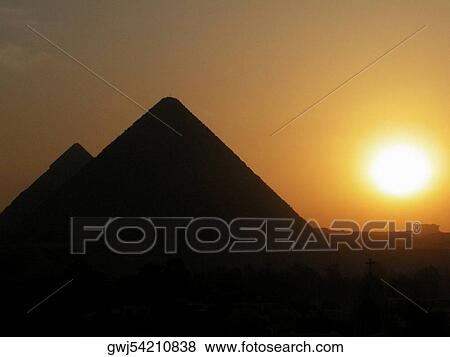 Silhouette of pyramids at sunset, Giza Pyramids, Giza, Cairo, Egypt View Large Photo Image Stock Photo - Silhouette of pyramids at sunset, Giza Pyramids, Giza, Cairo, Egypt. Fotosearch