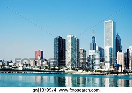 Skyscrapers along a lake, Lake Michigan, Chicago, Illinois, USA View Large Photo Image Picture - Skyscrapers along a lake, Lake Michigan, Chicago, Illinois, USA. Fotosearch