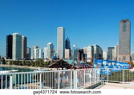 Skyscrapers along a lake, Lake Michigan, Navy Pier, Chicago, Illinois, USA View Large Photo Image Picture - Skyscrapers along a lake, Lake Michigan, Navy Pier, Chicago, Illinois, USA. Fotosearch