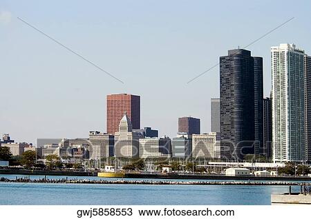 Skyscrapers along a lake, Lake Michigan, Chicago, Illinois, USA View Large Photo Image Stock Image - Skyscrapers along a lake, Lake Michigan, Chicago, Illinois, USA. Fotosearch
