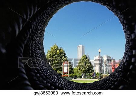 Skyscrapers viewed through a hole in a wall, Gateway Park, Chicago, Illinois, USA View Large Photo Image Stock Image - Skyscrapers viewed through a hole in a wall, Gateway Park, Chicago, Illinois, USA. Fotosearch
