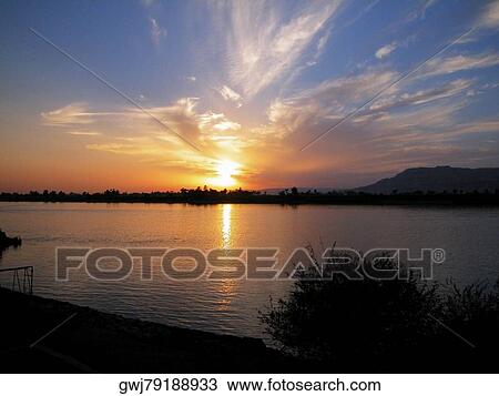 Sunset over a river View Large Photo Image Stock Image - Sunset over a river. Fotosearch