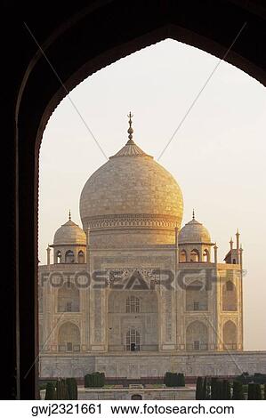 Stock Image - Taj Mahal seen through an arch, Agra, Uttar Pradesh, India. Fotosearch