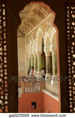 Stock Photo - Three people sitting inside a museum, Government Central Museum, Jaipur, Rajasthan, India. Fotosearch