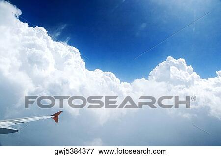 Tip of the wing of an airplane in flight View Large Photo Image Stock Photo - Tip of the wing of an airplane in flight. Fotosearch