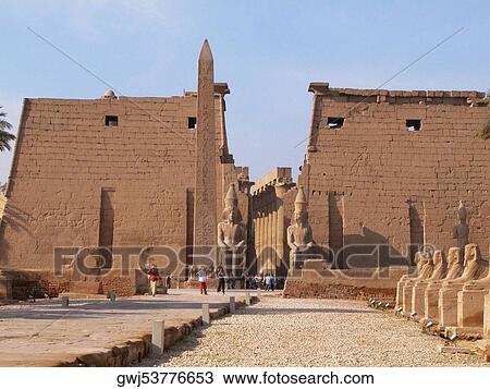 Tourists standing near a obelisk, Temple Of Luxor, Luxor, Egypt View Large Photo Image Stock Image - Tourists standing near a obelisk, Temple Of Luxor, Luxor, Egypt. Fotosearch