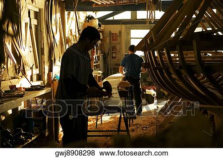 Two carpenters working in a workshop, Spain View Large Photo Image Stock Photo - Two carpenters working in a workshop, Spain. Fotosearch