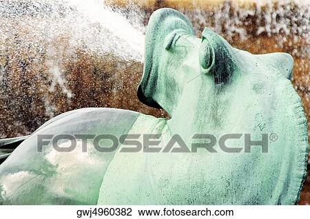 Water spraying from the mouth of a bronze statue, Clarence Buckingham Fountain, Chicago, Illinois, USA View Large Photo Image Stock Image - Water spraying from the mouth of a bronze statue, Clarence Buckingham Fountain, Chicago, Illinois, USA. Fotosearch
