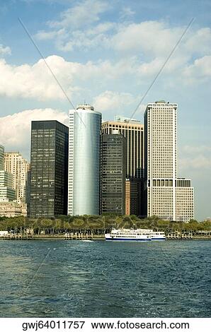 Boat in front of skyscrapers, New York City, New York State, USA View Large Photo Image Stock Photo - Boat in front of skyscrapers, New York City, New York State, USA. Fotosearch