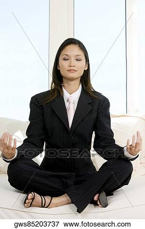 Businesswoman sitting in the lotus position View Large Photo Image Stock Photo - Businesswoman sitting in the lotus position. Fotosearch